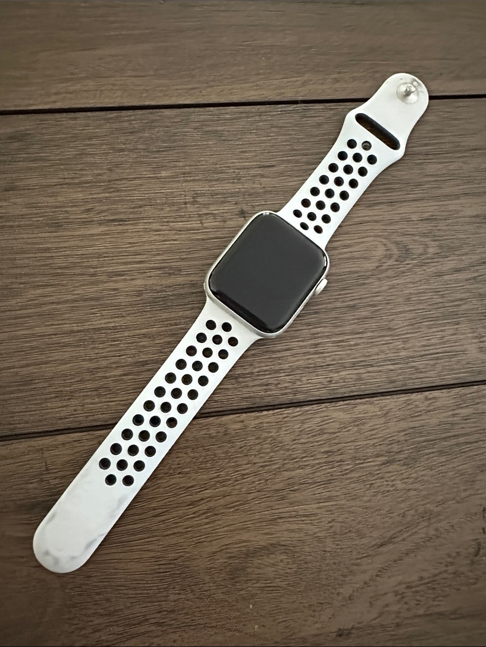 Apple Watch with White Perforated Sport Band. Nike addition series 5
